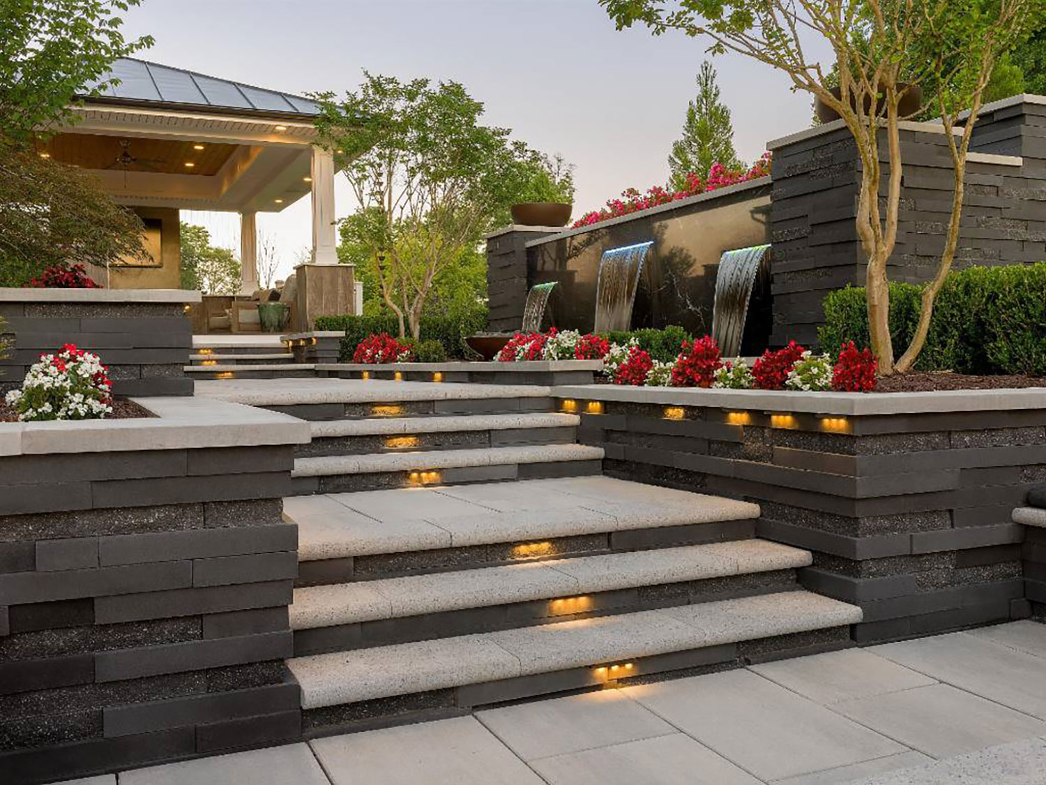 Modern hardscape with custom stone steps connecting patio levels