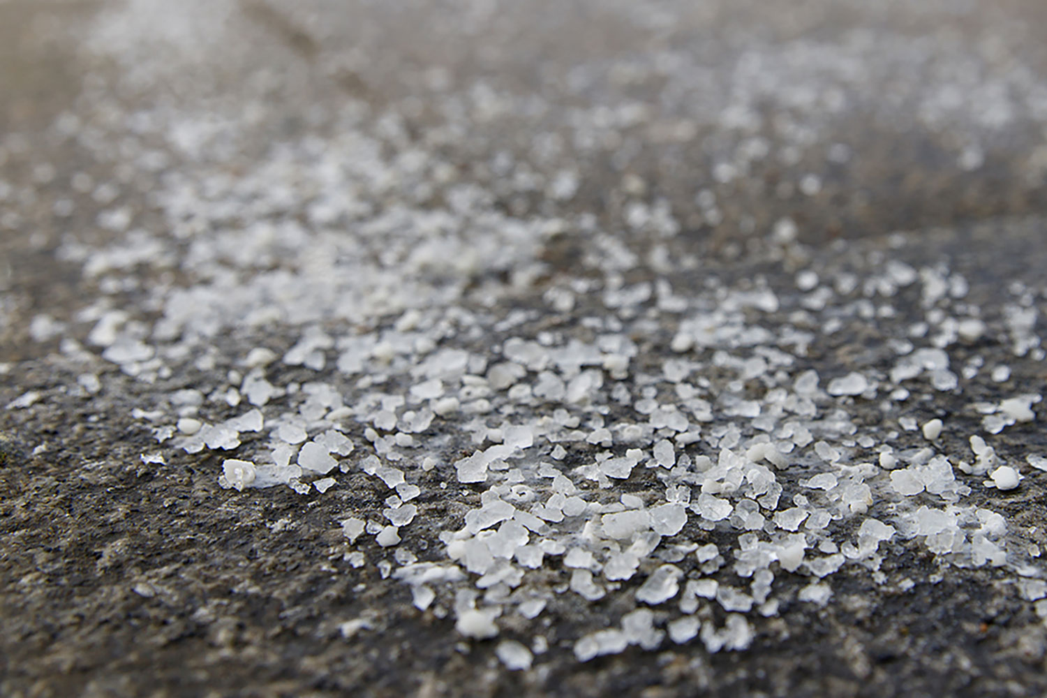 De-icing application on a commercial walk in Muncie